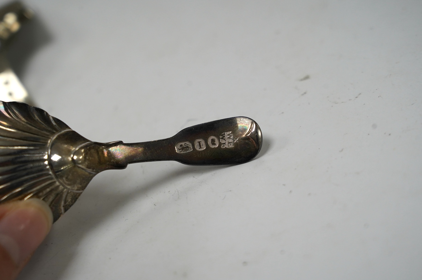 Five assorted silver caddy spoons, including shovel bowl by Cocks & Bettridge, Birmingham, 1810, 61mm, leaf bowl by William Pugh, Birmingham, 1814, Eley & Fearn, London, 1804, bright cut engraved bowl, George Baskerville